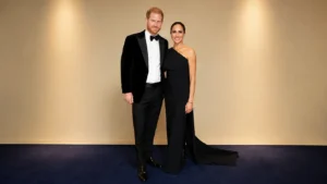 Prince Harry and Meghan Markle posing together at a formal gala event