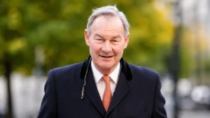 Senior businessman representing proposed UK tax reforms.