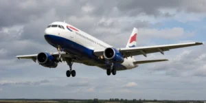 British Airways passenger aircraft descending with landing gear extended for a safe Heathrow landing